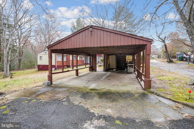 view of parking / parking lot with a carport