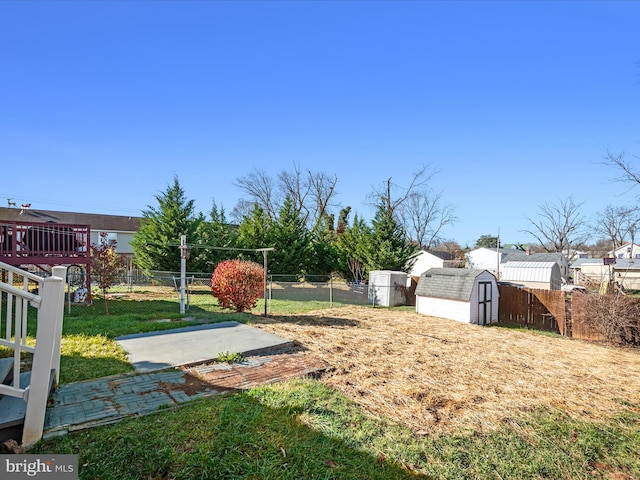 view of yard featuring a patio area and a shed