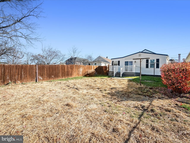 view of yard featuring a wooden deck