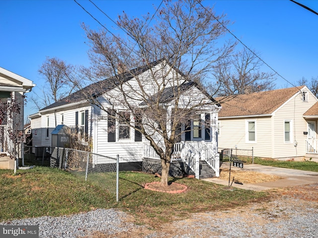 bungalow-style house with a front yard