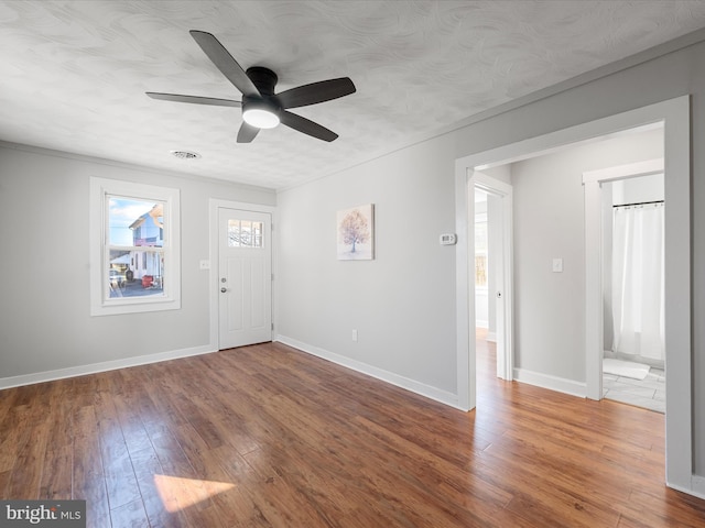 interior space featuring ceiling fan and wood-type flooring