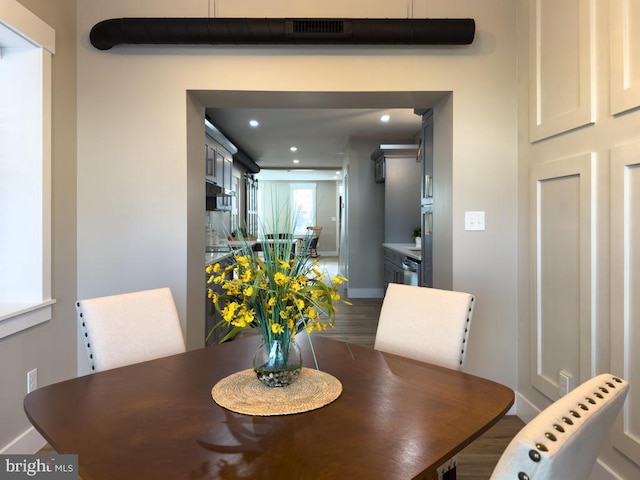 dining area with wood-type flooring