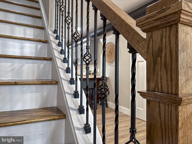 stairs with hardwood / wood-style floors