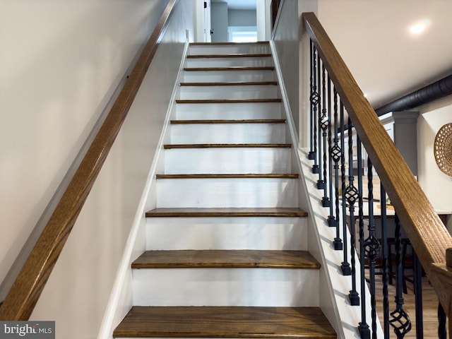 stairs with hardwood / wood-style floors