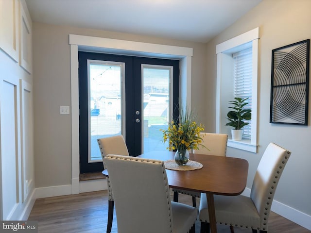 dining area featuring hardwood / wood-style floors and french doors