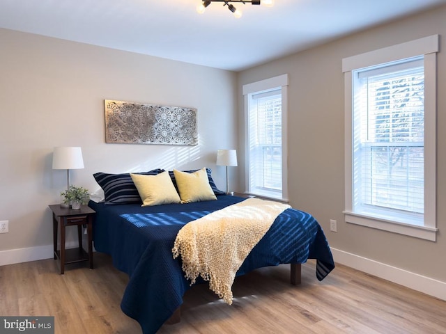 bedroom with wood-type flooring