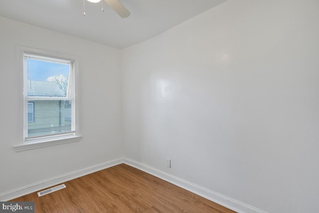 unfurnished room featuring hardwood / wood-style floors and ceiling fan