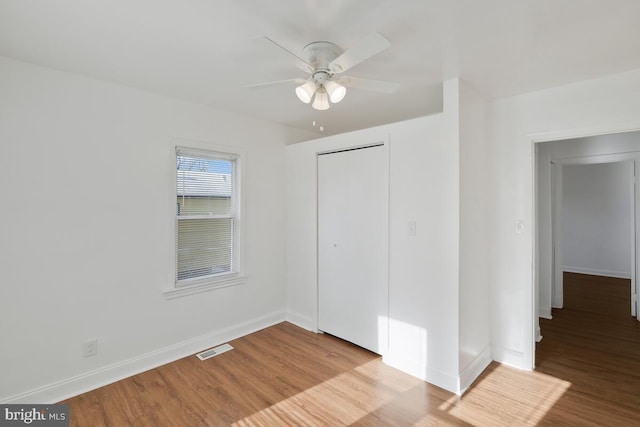 empty room featuring light hardwood / wood-style floors and ceiling fan