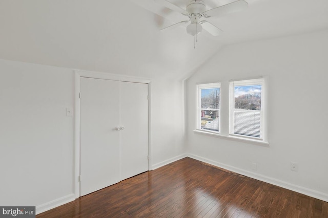 additional living space with vaulted ceiling, ceiling fan, and dark wood-type flooring