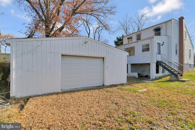 garage with a yard