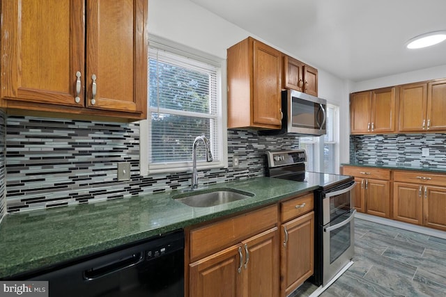 kitchen featuring backsplash, sink, and stainless steel appliances