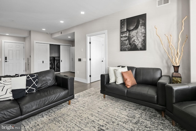1028 Bladensburg Rd NE Unit 38, Washington, DC 20002 - living room featuring washer and dryer, wood finished floors, electric panel, baseboards, and recessed lighting