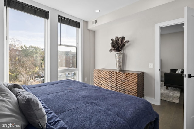 bedroom with hardwood / wood-style flooring