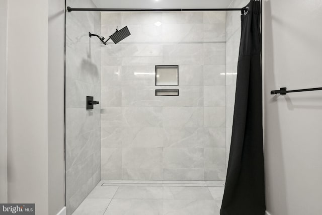 1028 Bladensburg Rd NE Unit 38, Washington, DC 20002 - bathroom featuring a tile shower and marble look tile flooring
