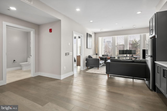 1028 Bladensburg Rd NE Unit 38, Washington, DC 20002 - living area with hardwood / wood-style flooring, baseboards, and recessed lighting