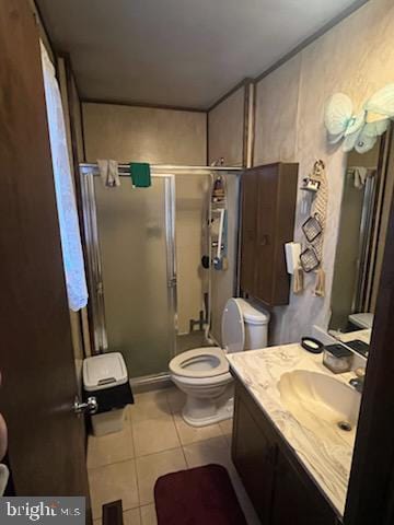 bathroom with toilet, an enclosed shower, vanity, and tile patterned floors