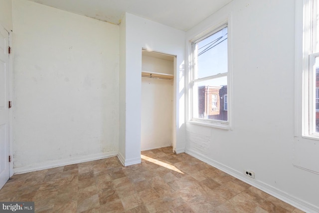 unfurnished bedroom featuring a closet