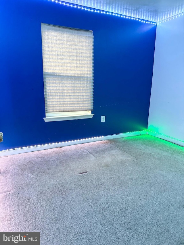 unfurnished room with carpet flooring