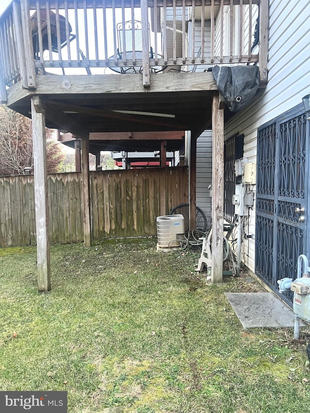 view of yard featuring cooling unit and a wooden deck