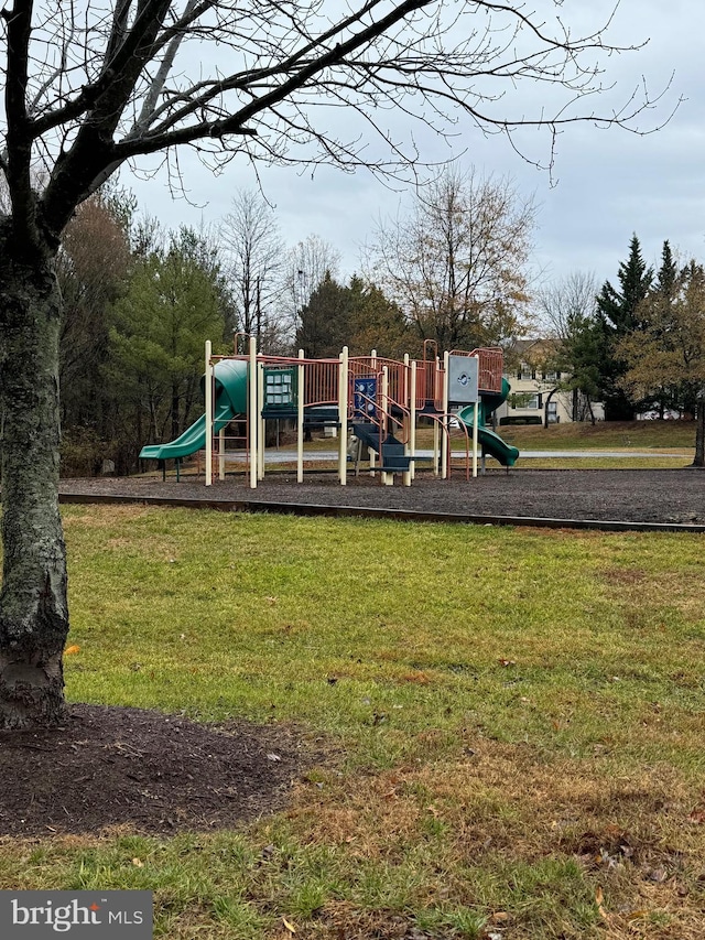 view of playground featuring a lawn