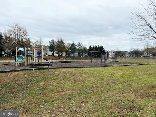 view of playground with a lawn