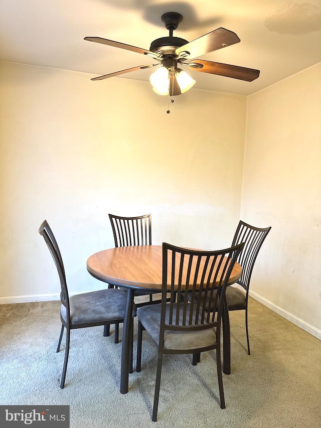 dining room featuring carpet and ceiling fan