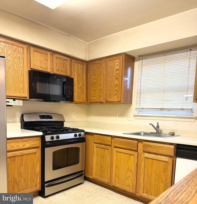 kitchen featuring stainless steel appliances and sink