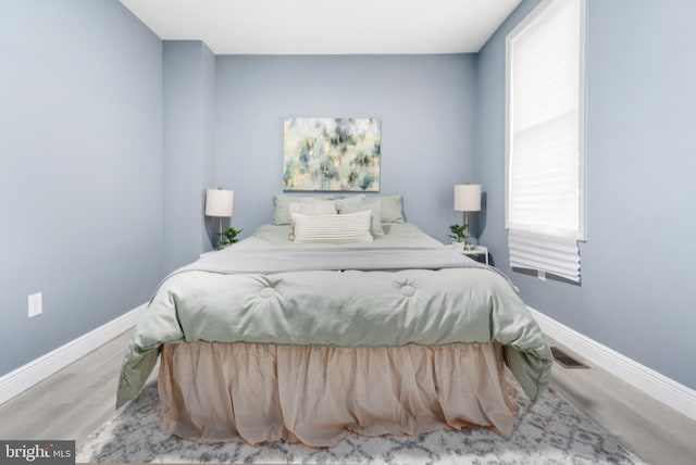 bedroom featuring wood-type flooring