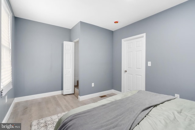 bedroom featuring light hardwood / wood-style floors