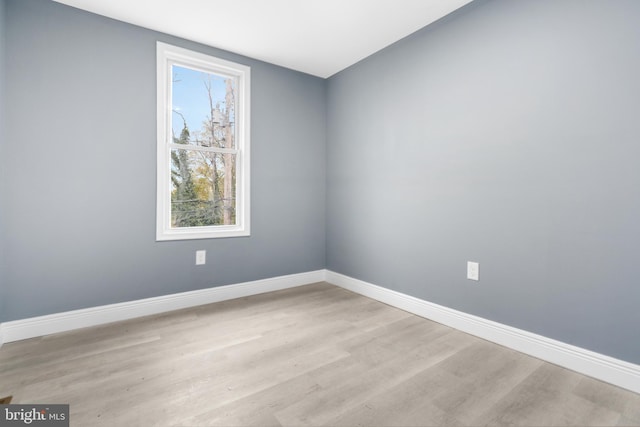 empty room with light hardwood / wood-style floors