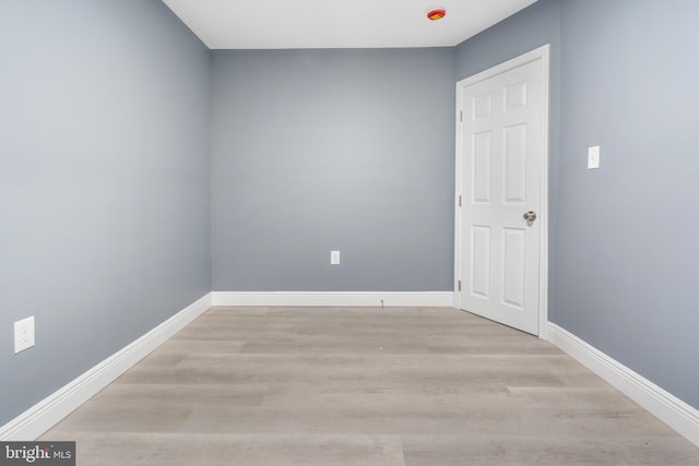 unfurnished room with light wood-type flooring