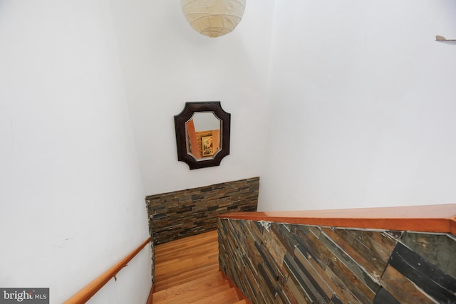 stairway featuring wood-type flooring