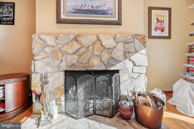 interior details with a stone fireplace