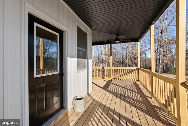 wooden deck featuring ceiling fan