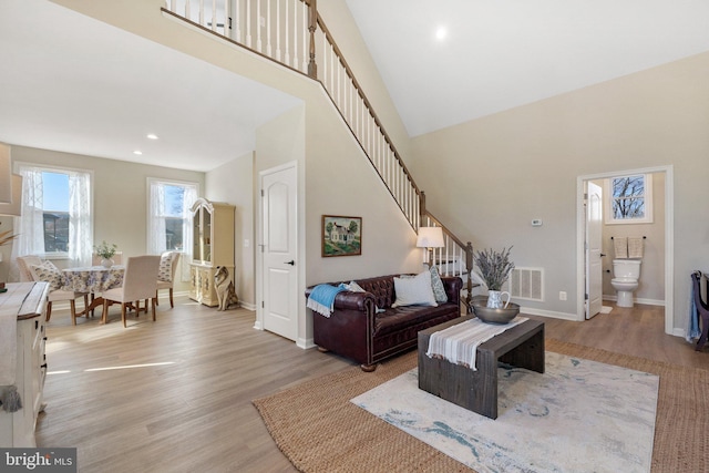 living room with light hardwood / wood-style flooring