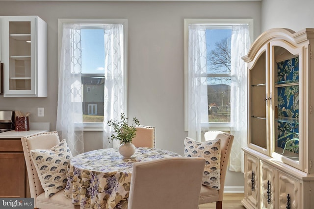 dining space with light wood-type flooring