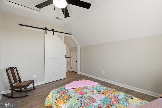 bedroom featuring lofted ceiling, ceiling fan, and dark hardwood / wood-style floors