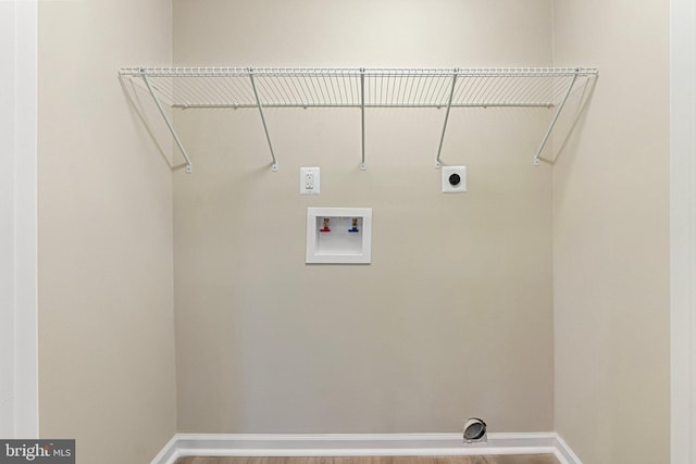 clothes washing area featuring electric dryer hookup and washer hookup