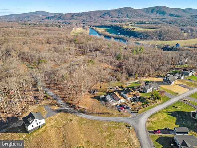 aerial view featuring a water and mountain view