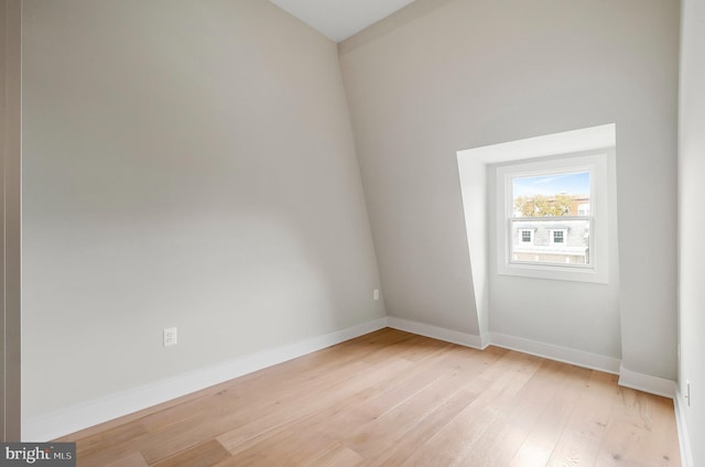 empty room with light hardwood / wood-style flooring