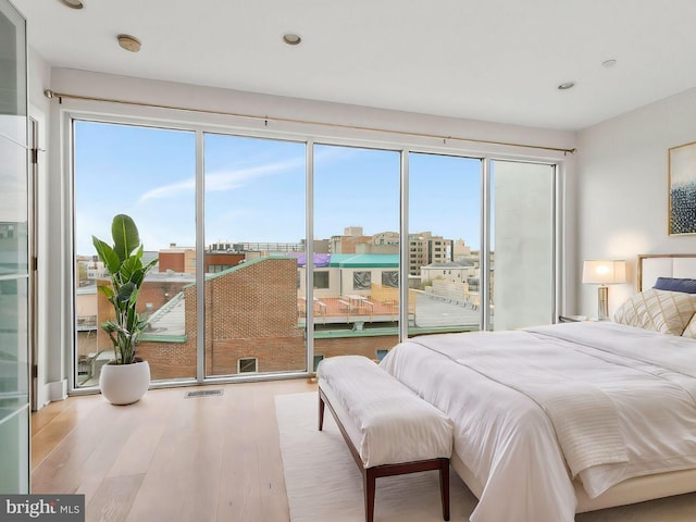 bedroom with light hardwood / wood-style floors