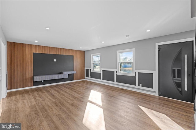 unfurnished living room featuring light hardwood / wood-style floors