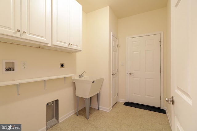 washroom featuring cabinets, hookup for a washing machine, and electric dryer hookup