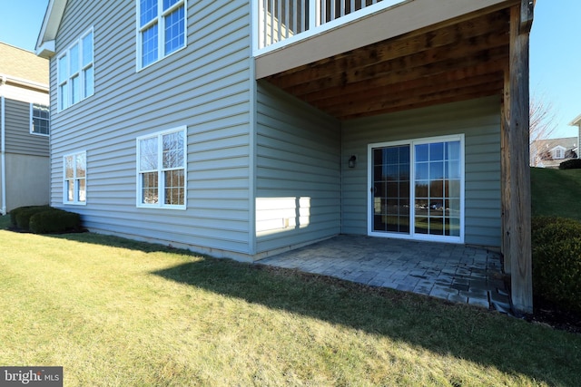 exterior space with a patio area and a yard