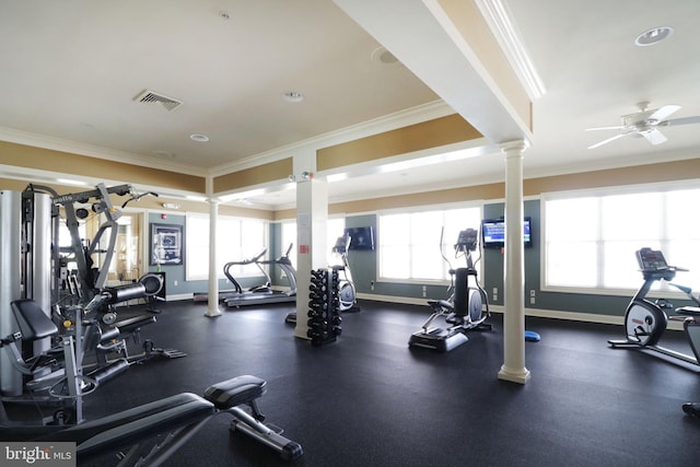 exercise room with ceiling fan, ornate columns, and crown molding