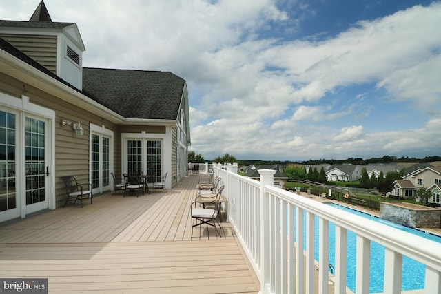 deck with a fenced in pool