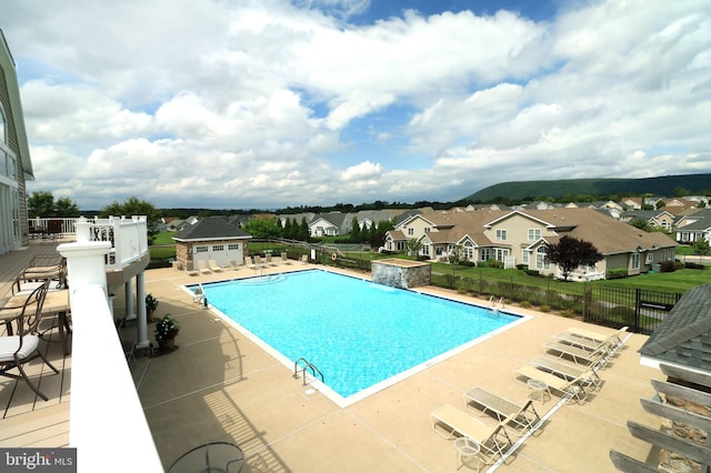 view of swimming pool with a patio