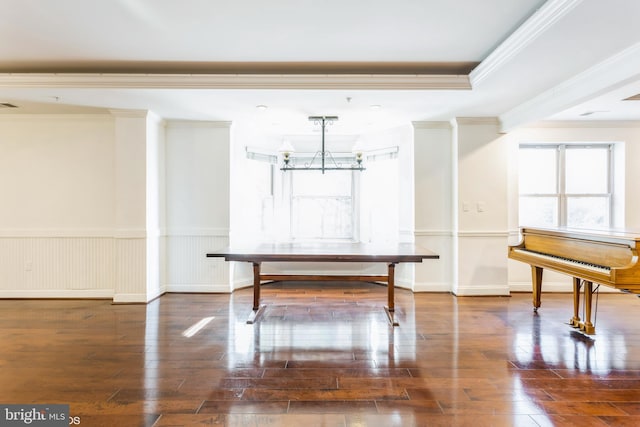 7902 Brynmor Ct Unit 201, Pikesville, MD 21208 - unfurnished dining area featuring hardwood / wood-style flooring, a chandelier, crown molding, and a wainscoted wall