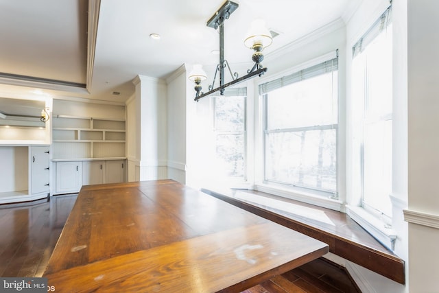 7902 Brynmor Ct Unit 201, Pikesville, MD 21208 - unfurnished dining area featuring ornamental molding, hardwood / wood-style floors, a chandelier, and built in shelves