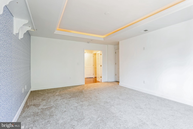 7902 Brynmor Ct Unit 201, Pikesville, MD 21208 - empty room with a tray ceiling, light carpet, and baseboards
